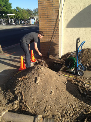 Garland plumbing contractor snakes a commercial drain line